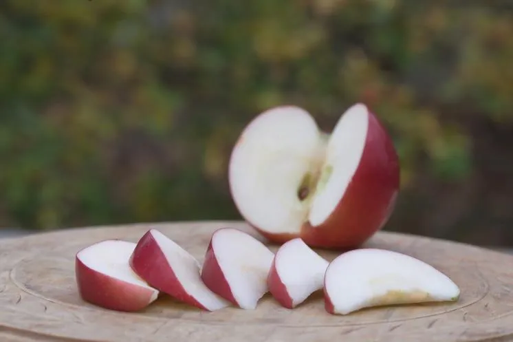 Sliced apple on a wooden cutting board